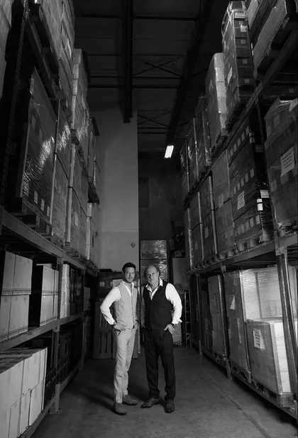 Marcelo Pelleriti and Miguel Priore in the winery's barrel room