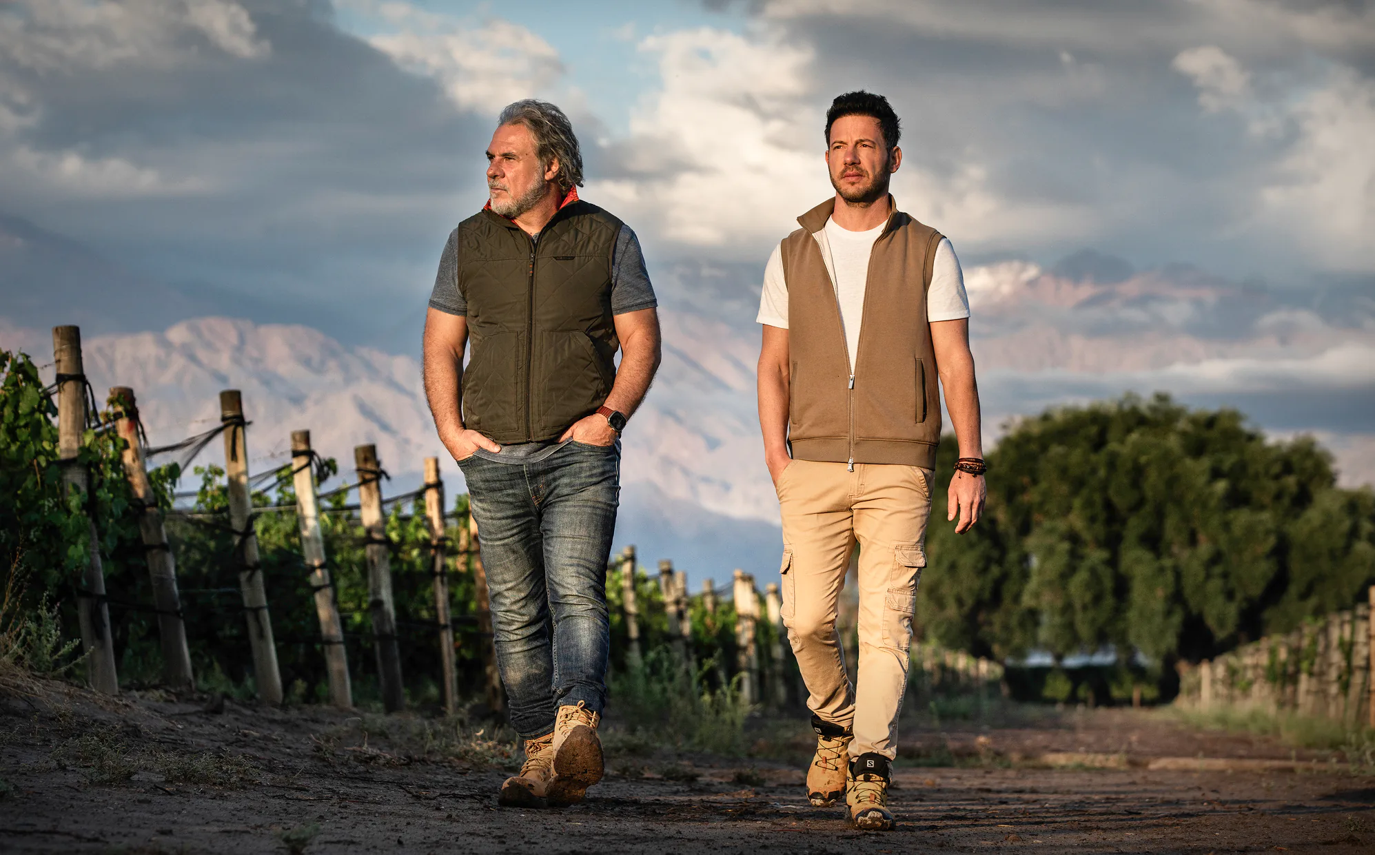 Marcelo Pelleriti and Miguel Priore walking through the rows of a vineyard in the Uco Valley